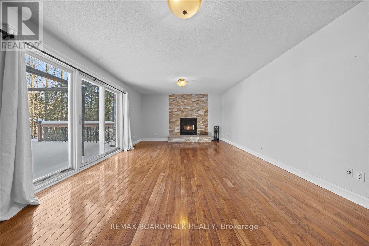 7089 Bush Drive, Ottawa, ON - Indoor Photo Showing Living Room With Fireplace