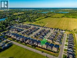 Aerial perspective showcasing a residential development with a mix of detached and semi-detached homes -
