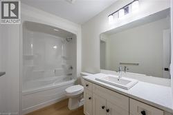 White bathtub/shower combination with chrome fixtures -