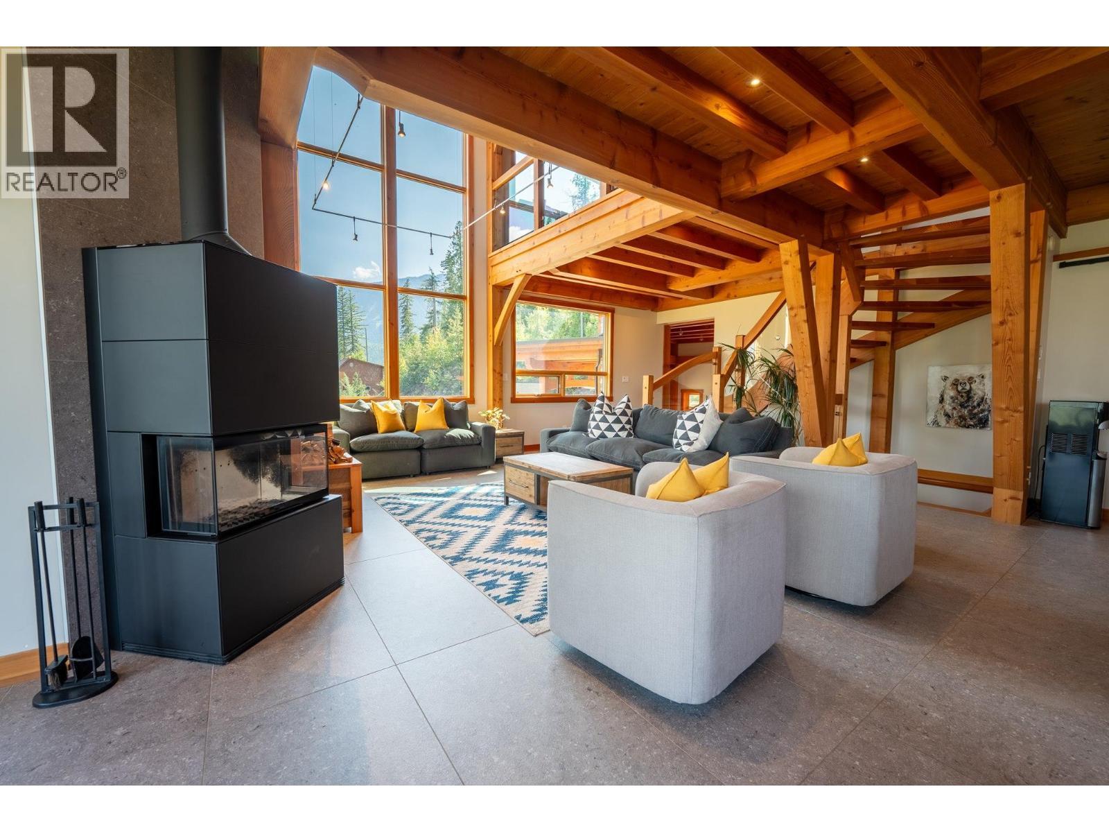 Wood buring f/p - 1917 Mt Mcpherson Drive, Revelstoke, BC - Indoor With Fireplace