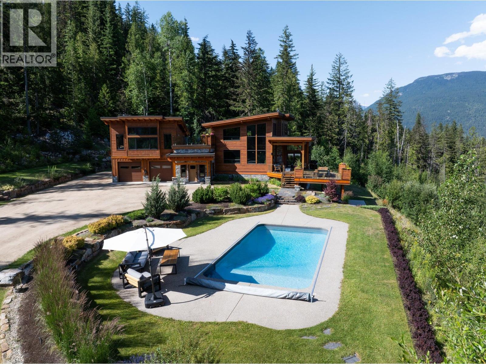 1917 Mt Mcpherson Drive, Revelstoke, BC - Outdoor With In Ground Pool With Deck Patio Veranda