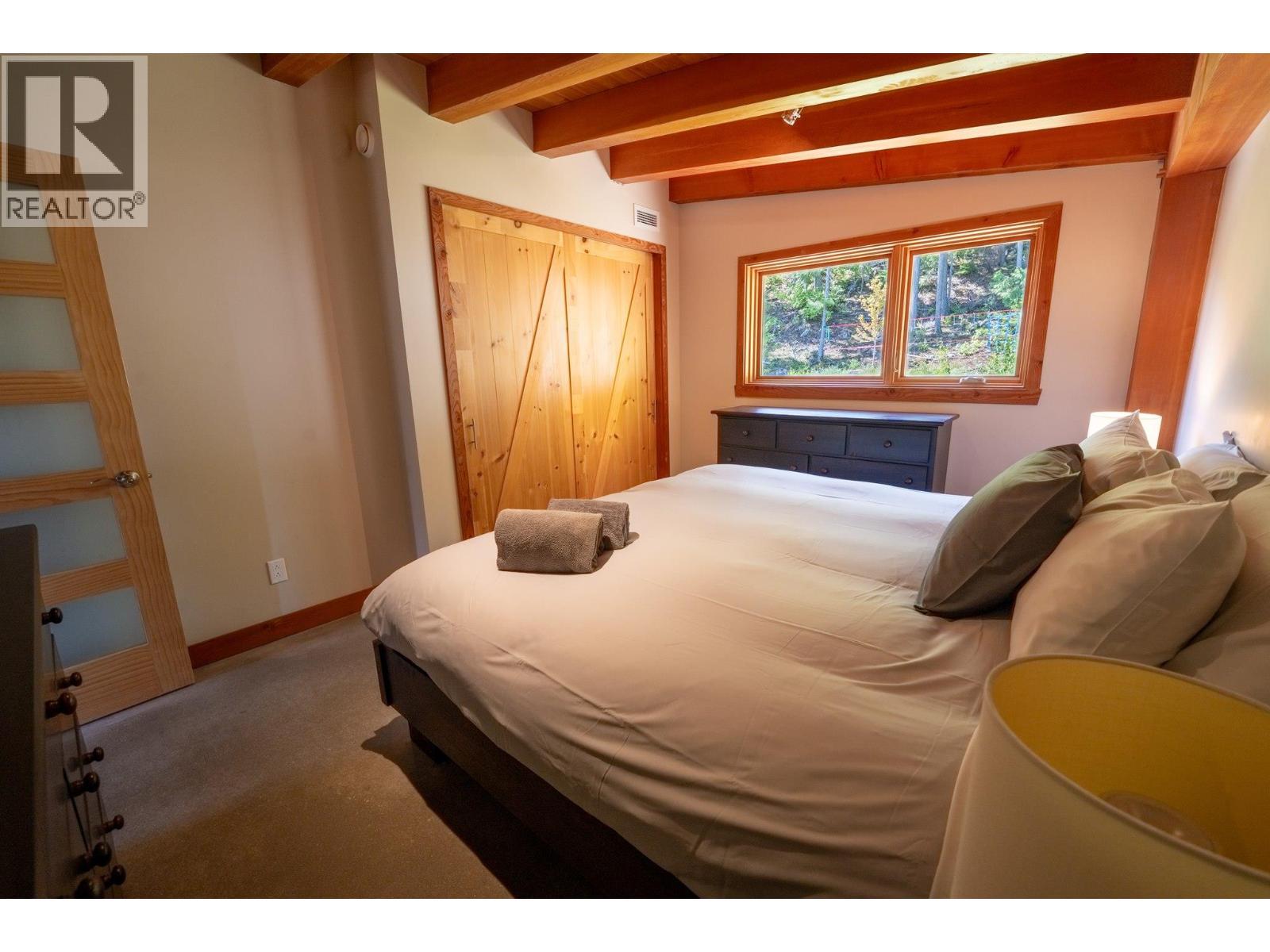 Suite primary - 1917 Mt Mcpherson Drive, Revelstoke, BC - Indoor Photo Showing Bedroom