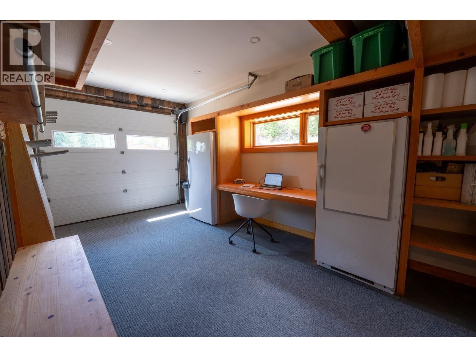 Attached garage - 1917 Mt Mcpherson Drive, Revelstoke, BC - Indoor Photo Showing Garage