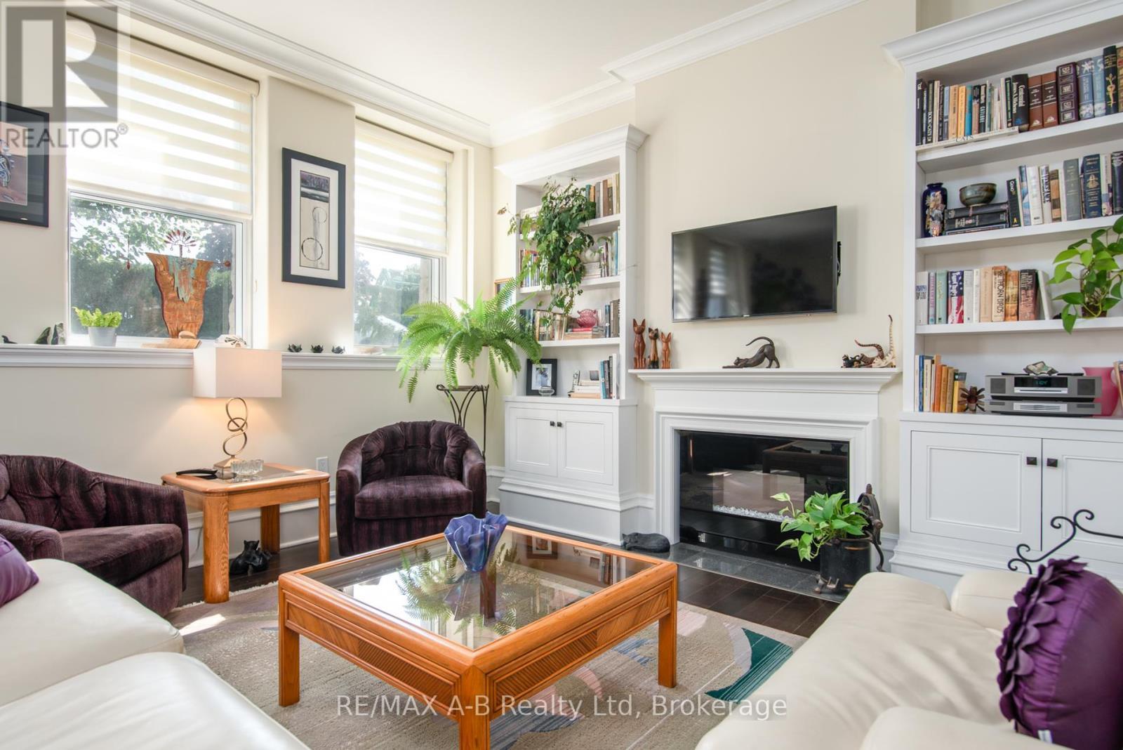 1C - 189 Elizabeth Street, St. Marys, ON - Indoor Photo Showing Living Room With Fireplace