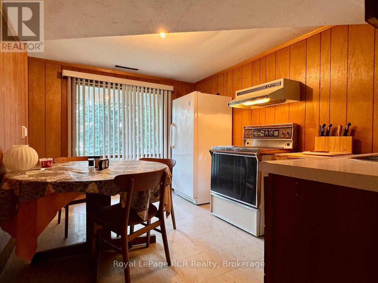 Lower level kitchenette with water view. - 2 William Street, Northern Bruce Peninsula, ON - Indoor Photo Showing Kitchen
