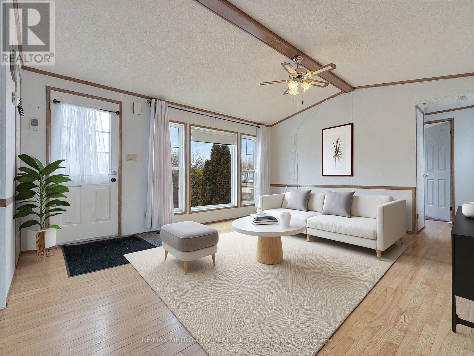 Photo has been virtually staged - 34 Sunset Lane, Horton, ON - Indoor Photo Showing Living Room