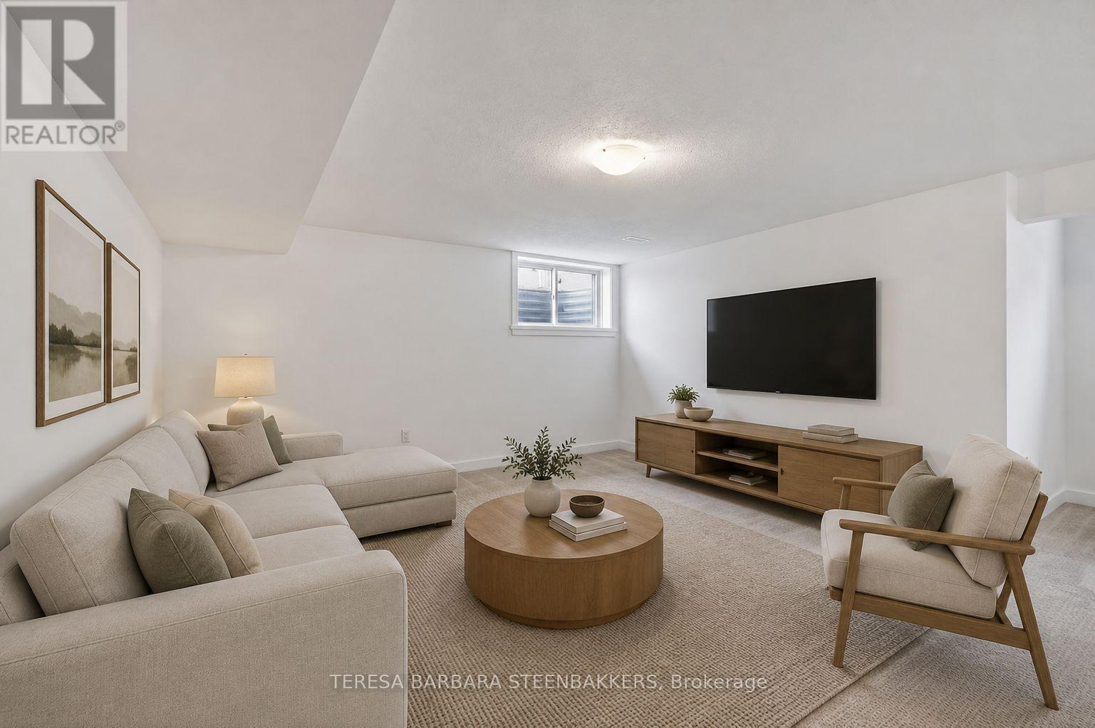 Virtually staged finished basement Family room - 1164 Bronze Avenue, Clarence-Rockland, ON - Indoor Photo Showing Living Room