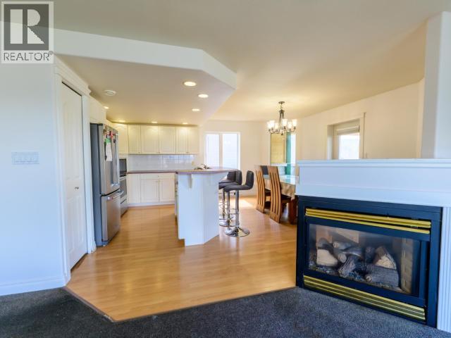 146 Falcon Drive, Whitehorse, YT - Indoor Photo Showing Living Room With Fireplace