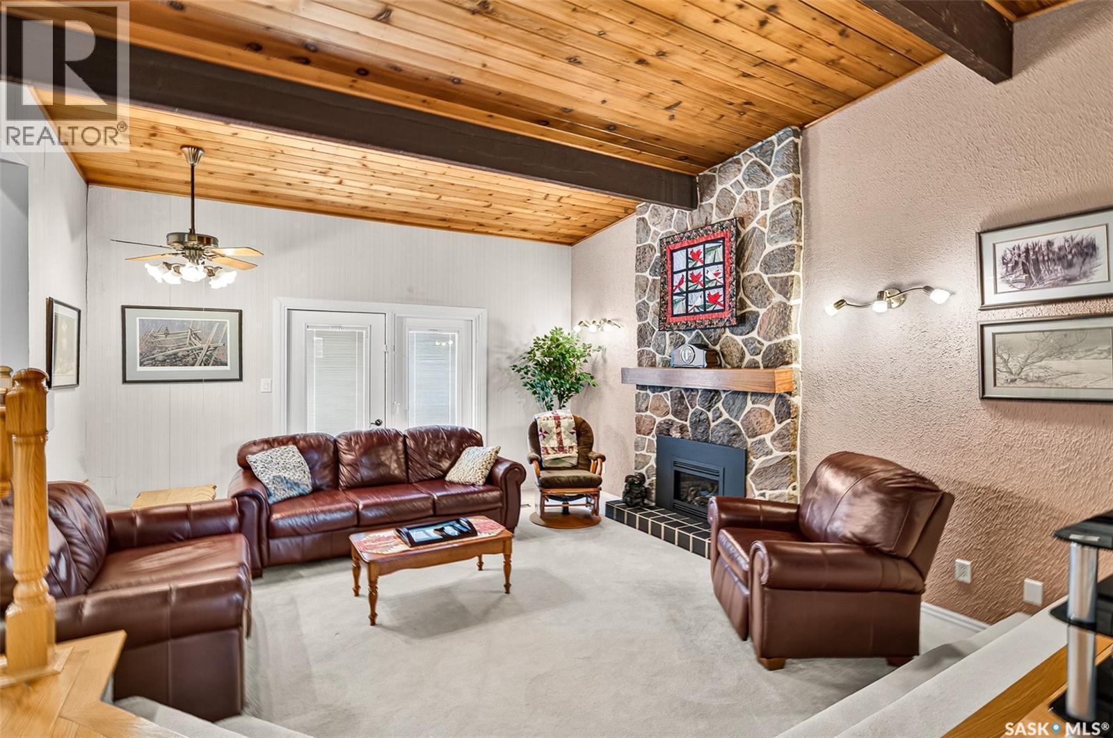 1188 2Nd Avenue Ne, Moose Jaw, SK - Indoor Photo Showing Living Room With Fireplace
