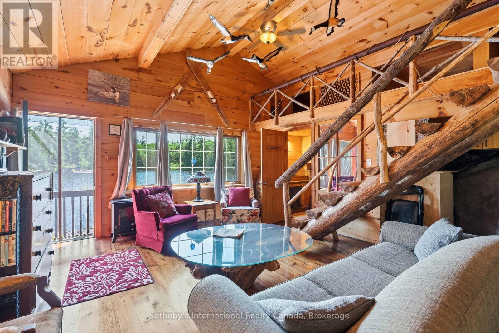 1 Island 29Kl Kahshe Lake - Cooee Island, Gravenhurst (Morrison), ON - Indoor Photo Showing Living Room With Fireplace
