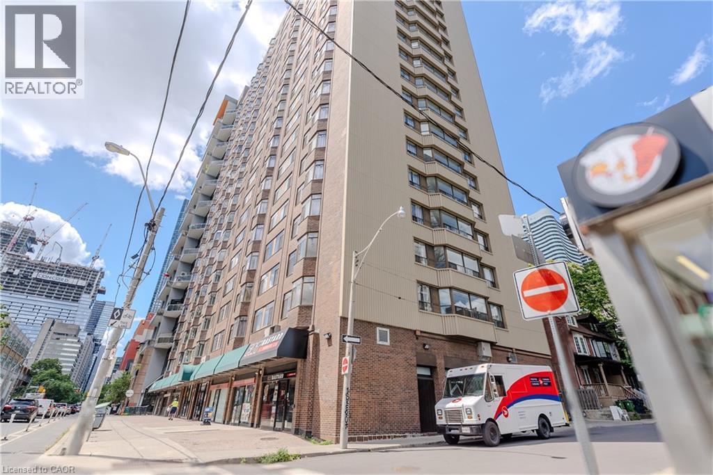 High-rise building featuring a light-toned facade and extensive window lines - 96 Gerrard St E, Toronto, ON