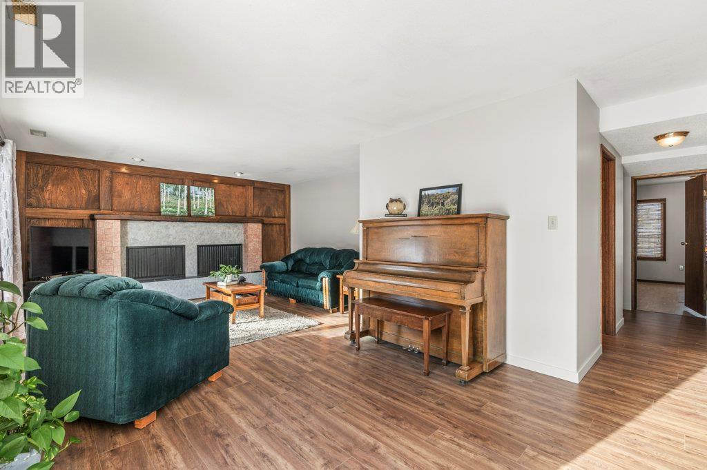 11410 Tassie Drive, Coldstream, BC - Indoor Photo Showing Living Room With Fireplace