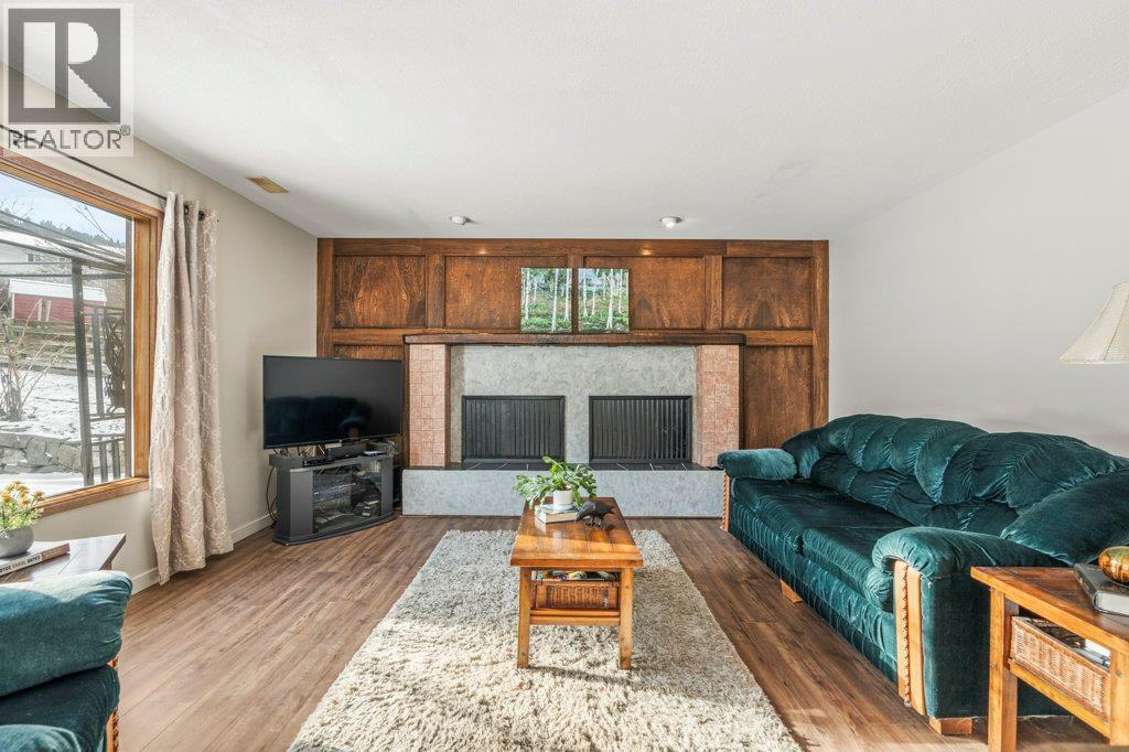 11410 Tassie Drive, Coldstream, BC - Indoor Photo Showing Living Room With Fireplace