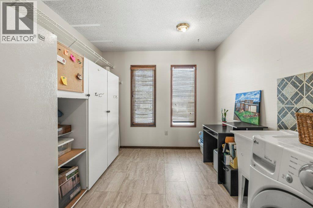 11410 Tassie Drive, Coldstream, BC - Indoor Photo Showing Laundry Room