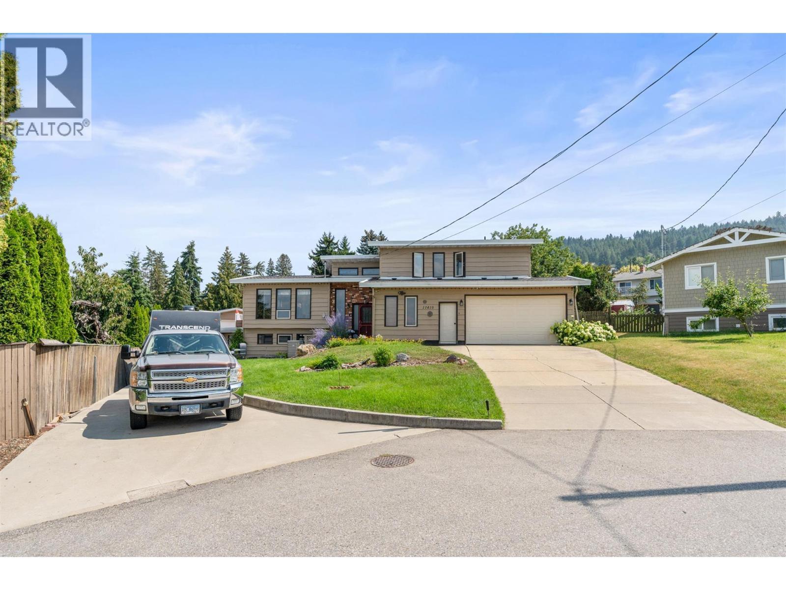 11410 Tassie Drive, Coldstream, BC - Outdoor With Facade