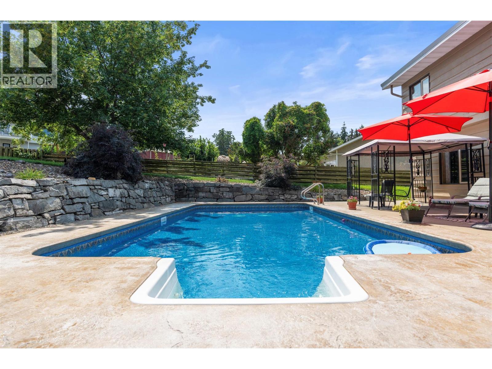 11410 Tassie Drive, Coldstream, BC - Outdoor With In Ground Pool With Deck Patio Veranda With Backyard