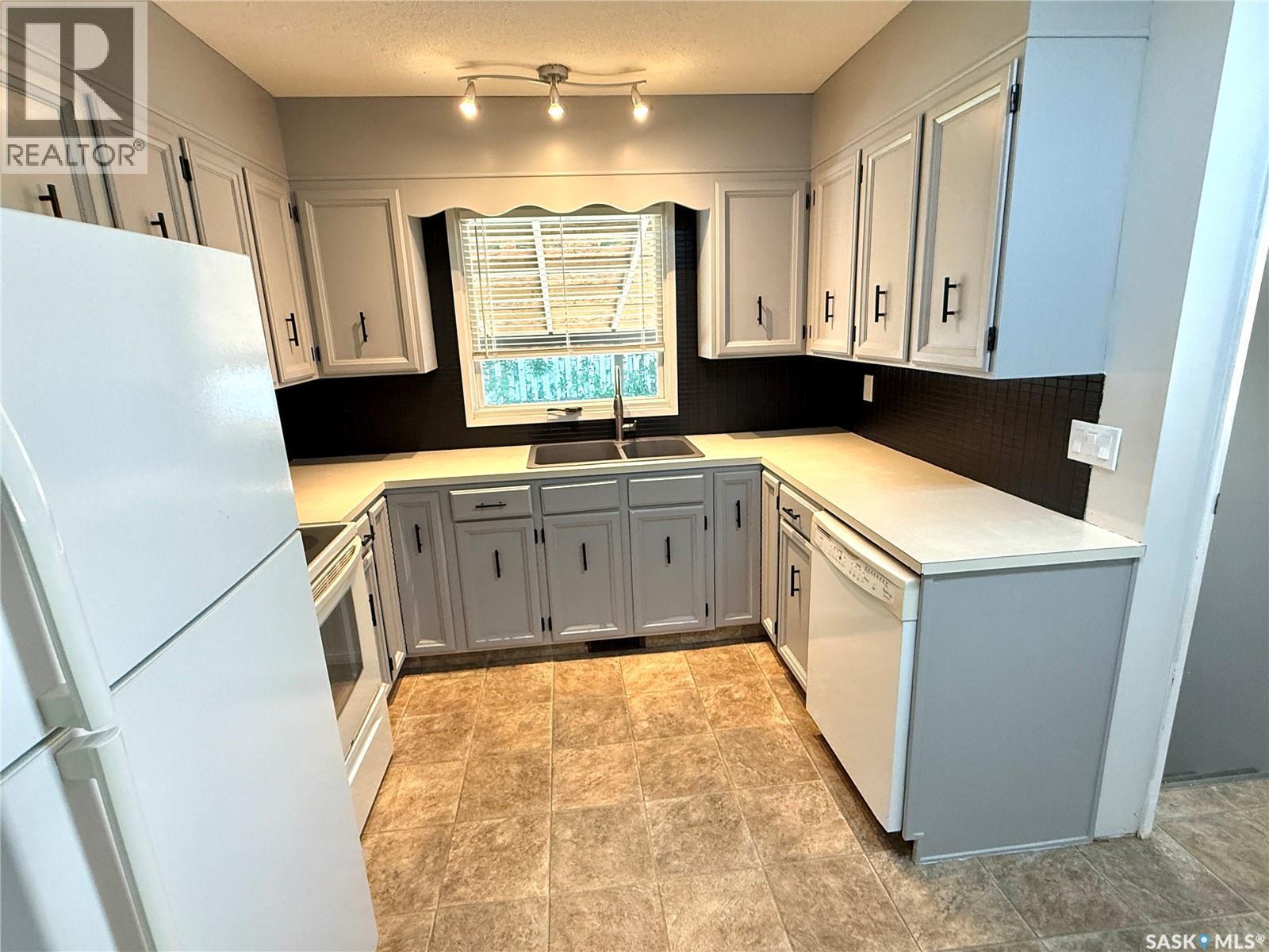 9026 Mitchell Avenue, North Battleford, SK - Indoor Photo Showing Kitchen With Double Sink