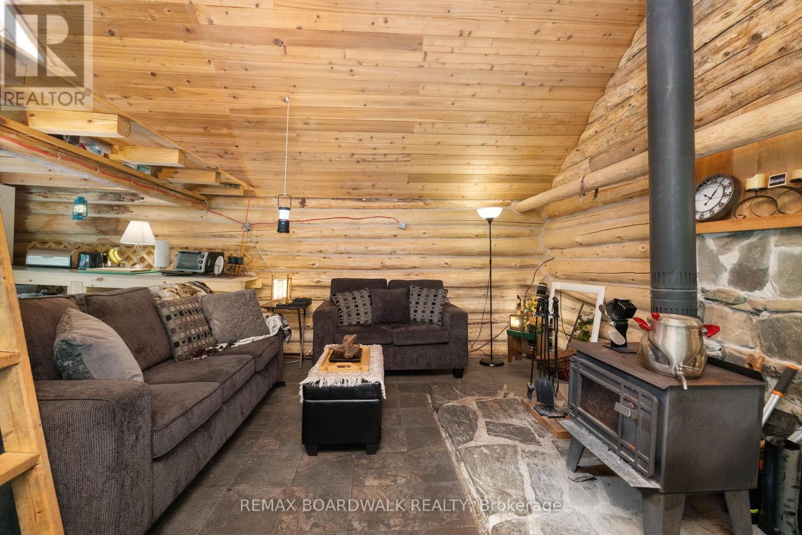 24163 Highway 7 Highway, Frontenac (Frontenac Centre), ON - Indoor Photo Showing Living Room With Fireplace