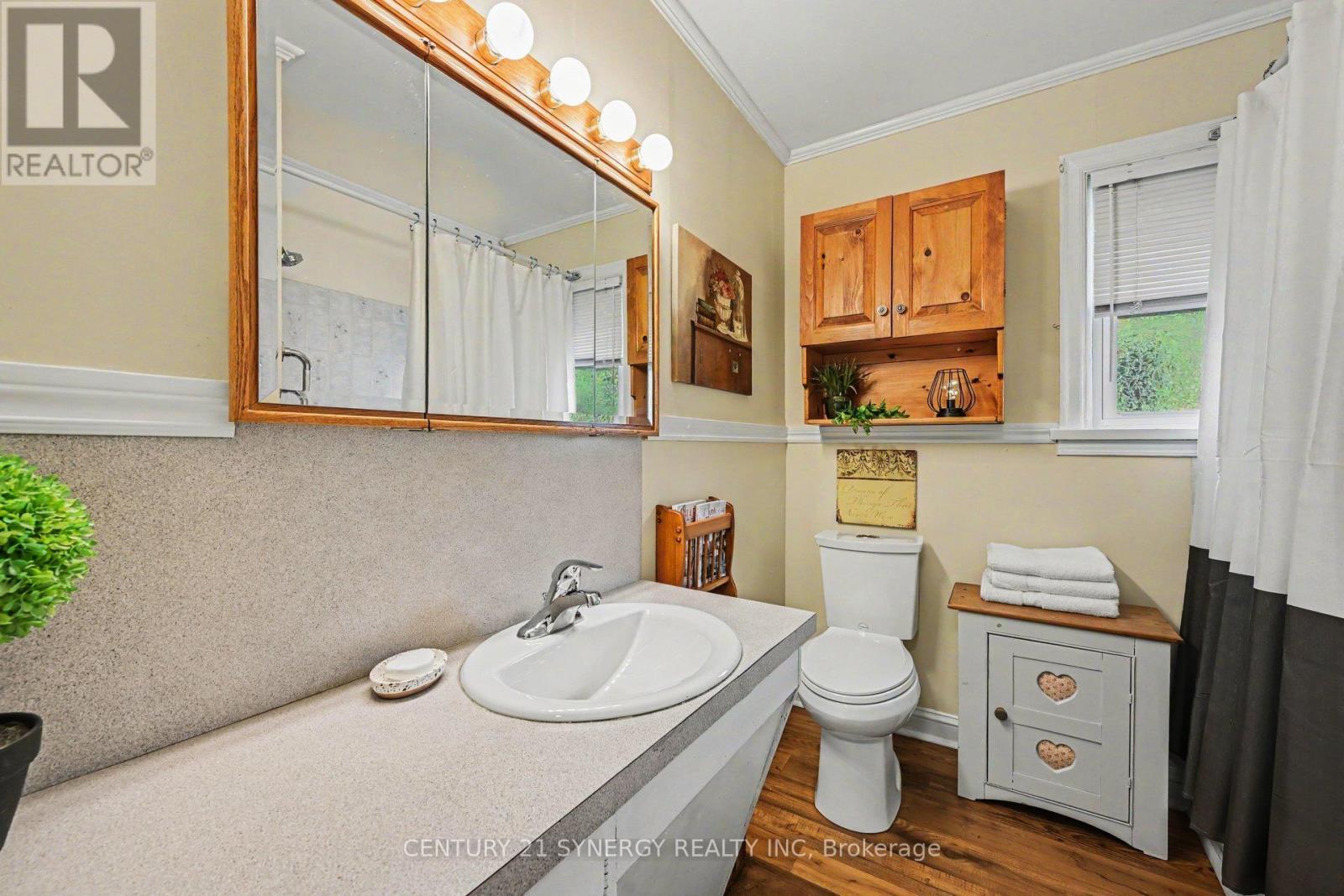 4pc bath with tub/shower combo & built-in storage. - 5 Queen Street, Smiths Falls, ON - Indoor Photo Showing Bathroom