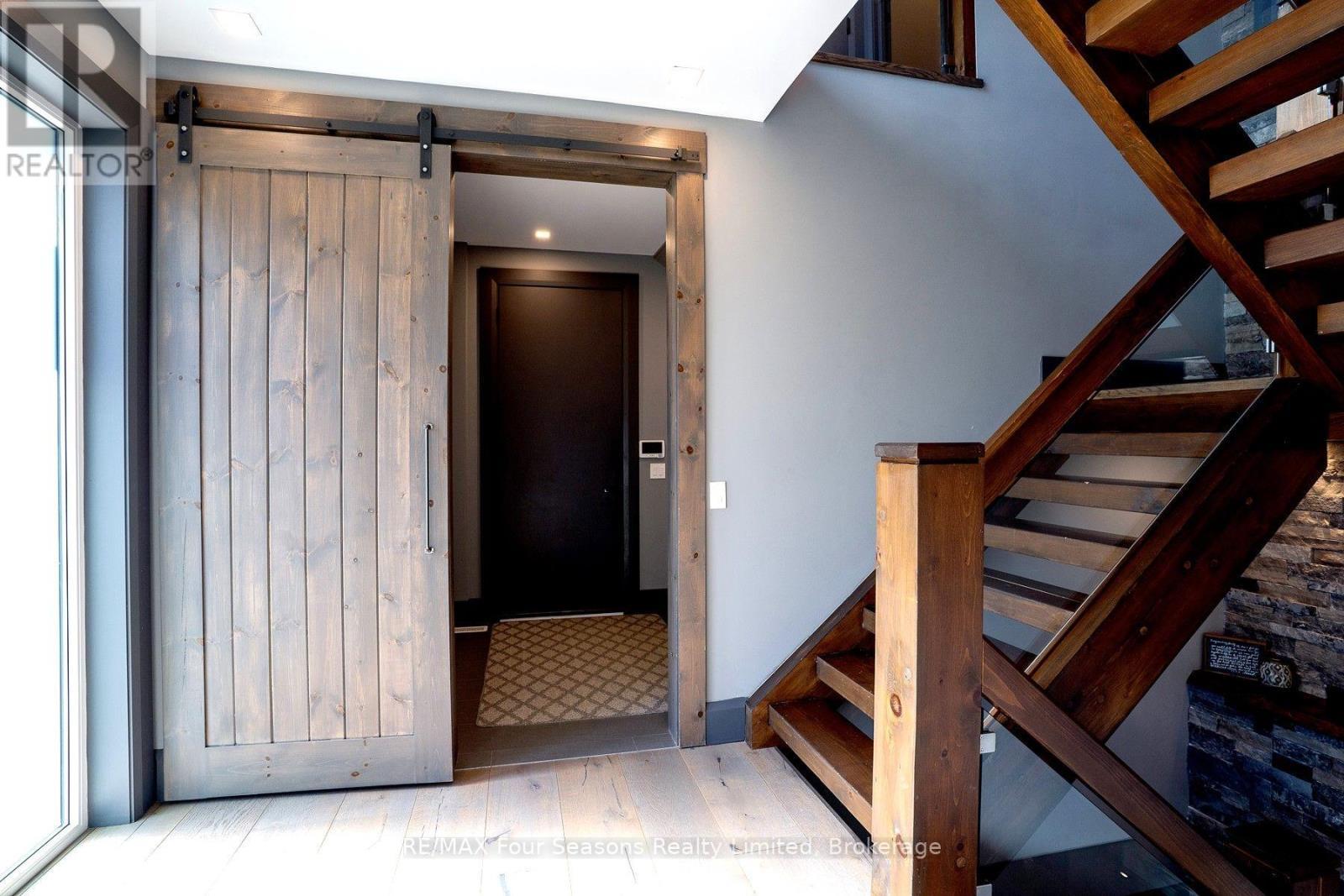 MAIN FLOOR ENTRY AND STAIRCASE - 116 Arnot Crescent, Blue Mountains, ON - Indoor Photo Showing Other Room