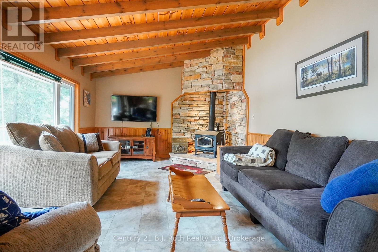 169 Odd'S Drive, Parry Sound Remote Area (Restoule), ON - Indoor Photo Showing Living Room With Fireplace