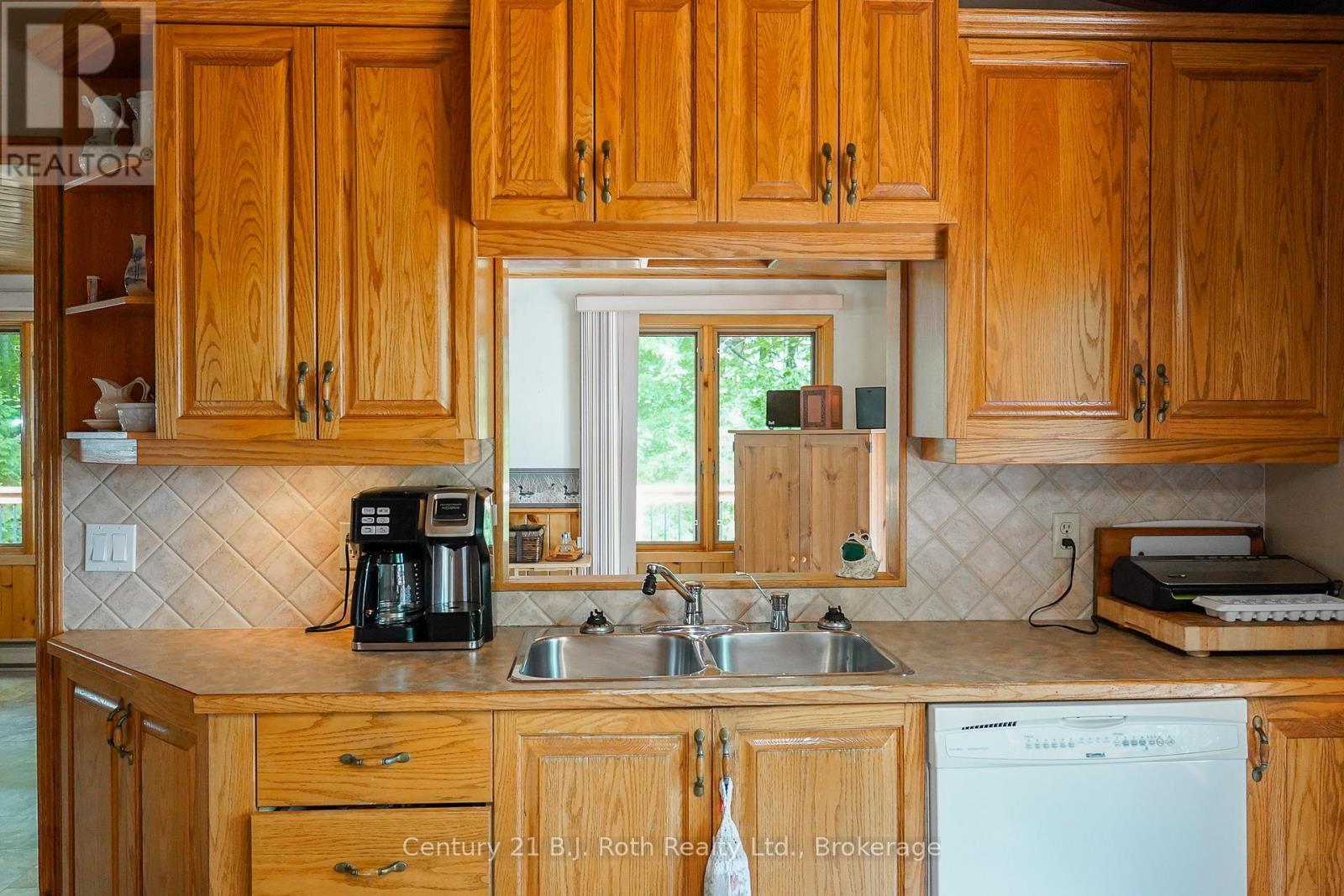 169 Odd'S Drive, Parry Sound Remote Area (Restoule), ON - Indoor Photo Showing Kitchen With Double Sink