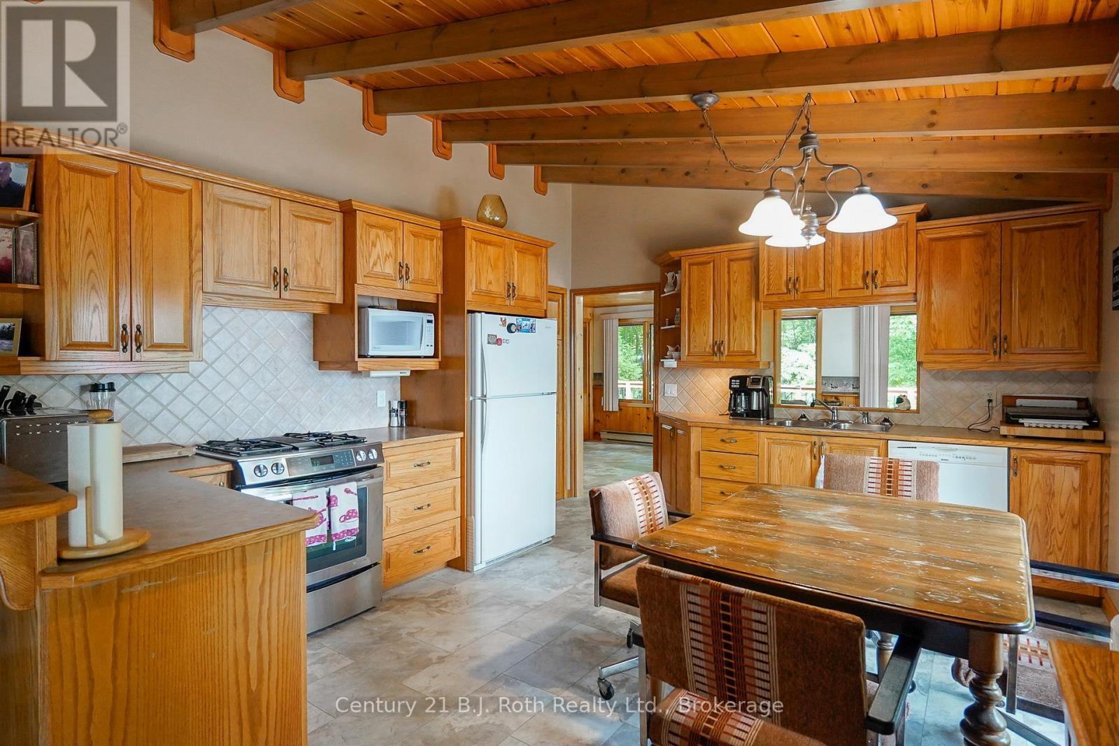 169 Odd'S Drive, Parry Sound Remote Area (Restoule), ON - Indoor Photo Showing Kitchen With Double Sink
