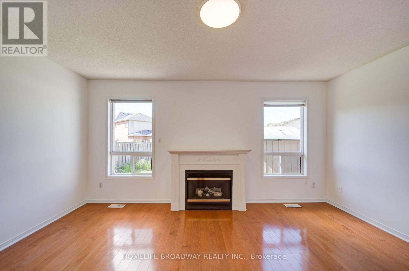 16 Raymond Bartlett Avenue, Markham, ON - Indoor Photo Showing Living Room With Fireplace