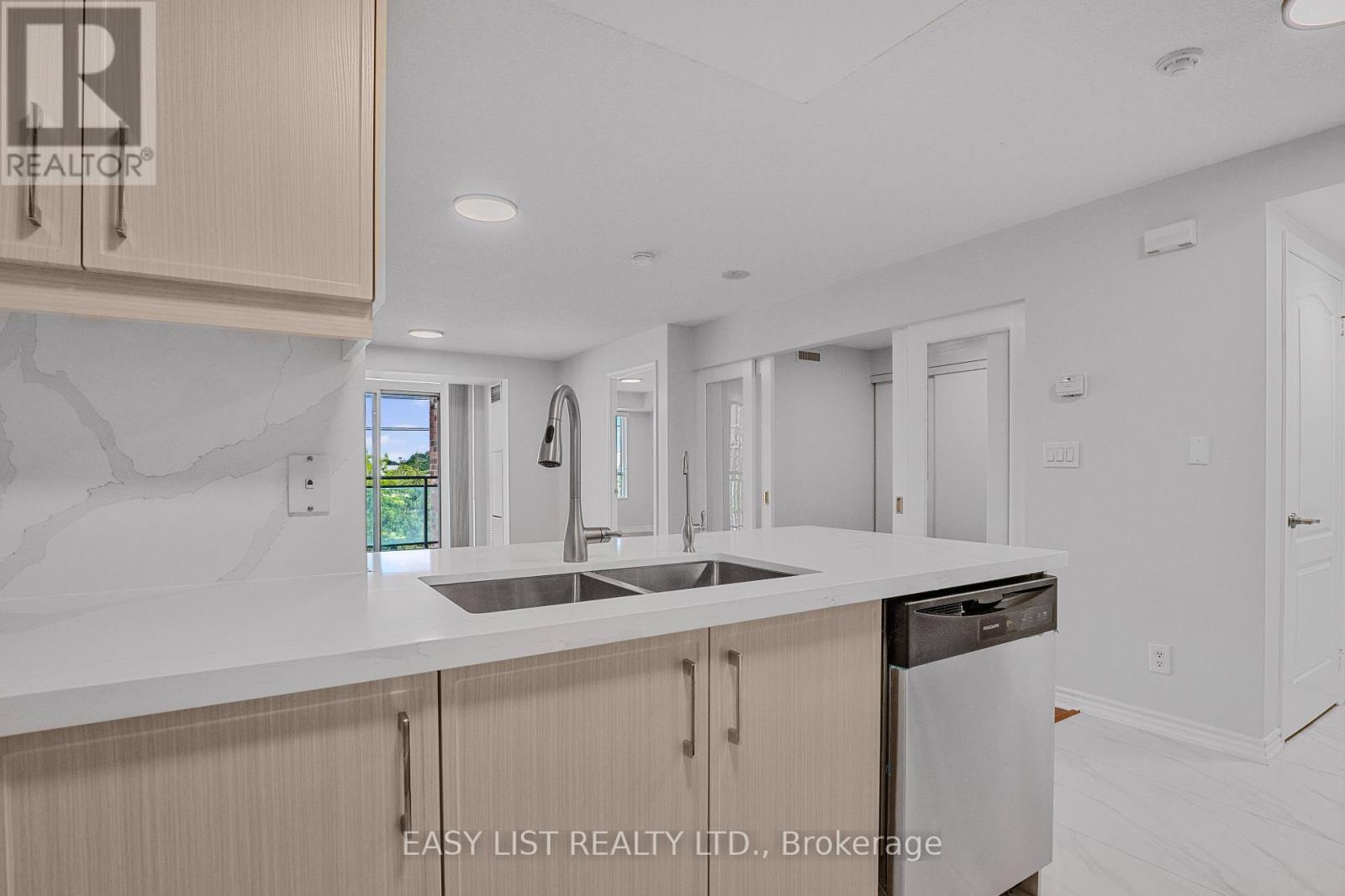 319 - 2020 Mcnicoll Avenue, Toronto, ON - Indoor Photo Showing Kitchen With Double Sink