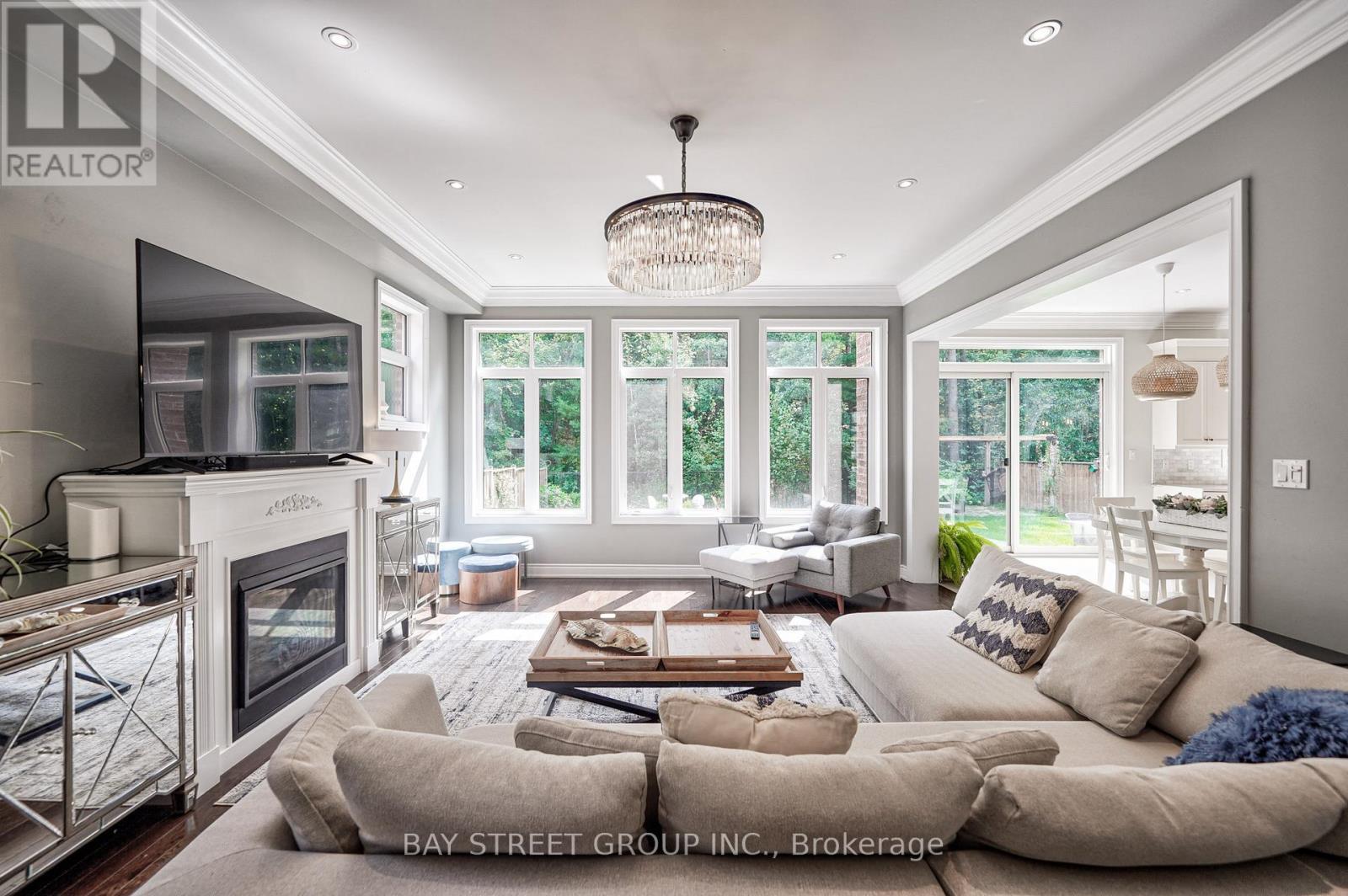 23 Trail Boulevard, Springwater, ON - Indoor Photo Showing Living Room With Fireplace
