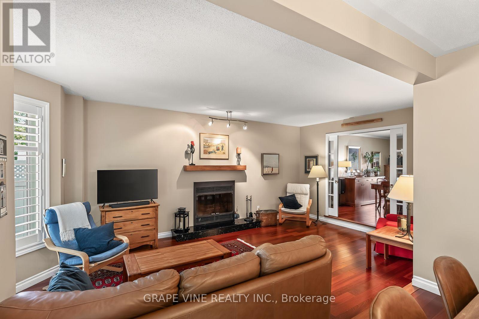 36 Baslaw Drive, Ottawa, ON - Indoor Photo Showing Living Room With Fireplace