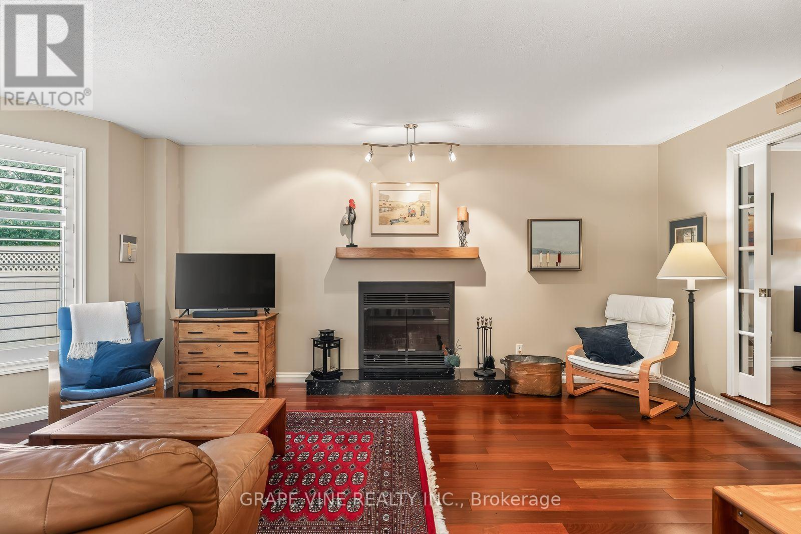 36 Baslaw Drive, Ottawa, ON - Indoor Photo Showing Living Room With Fireplace