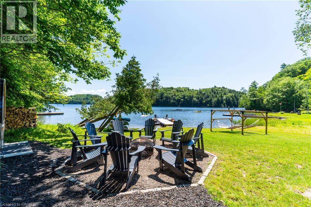 Fireplace Area - 1558 Fish Hatchery Road Unit# 10, Muskoka Lakes, ON - Outdoor With Body Of Water