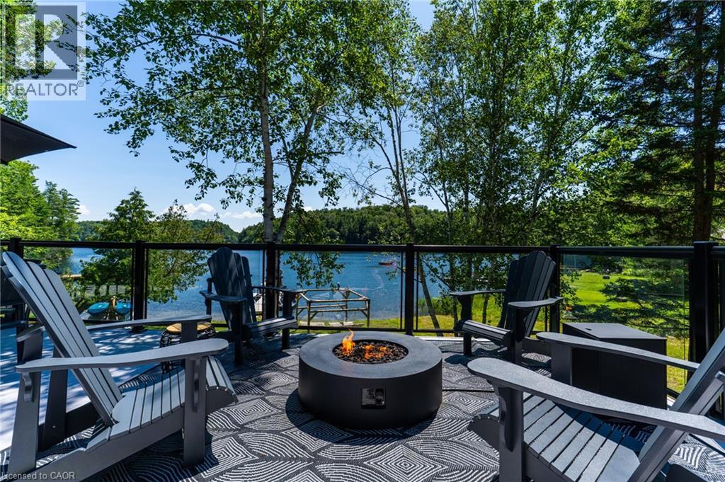 Upper Patio Deck Firepit area - 1558 Fish Hatchery Road Unit# 10, Muskoka Lakes, ON - Outdoor With Body Of Water