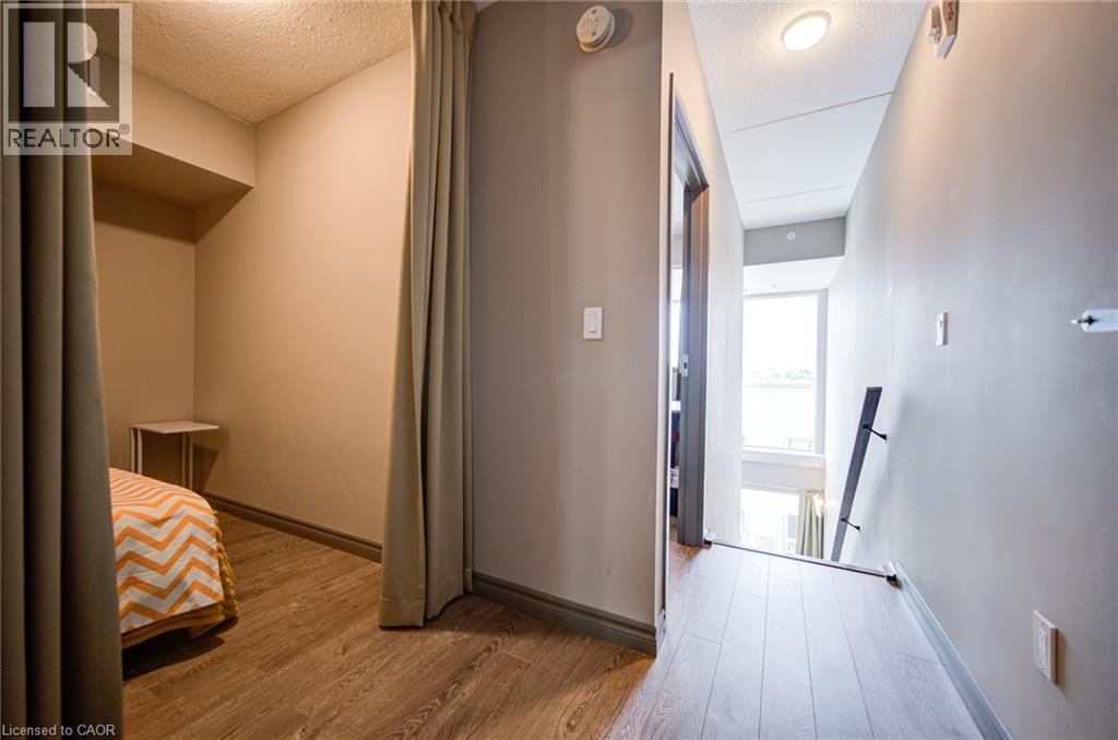 Hallway featuring wood-finish flooring, recessed lighting, and neutral wall tones - 321 Spruce Street Unit# 710, Waterloo, ON - Indoor Photo Showing Other Room