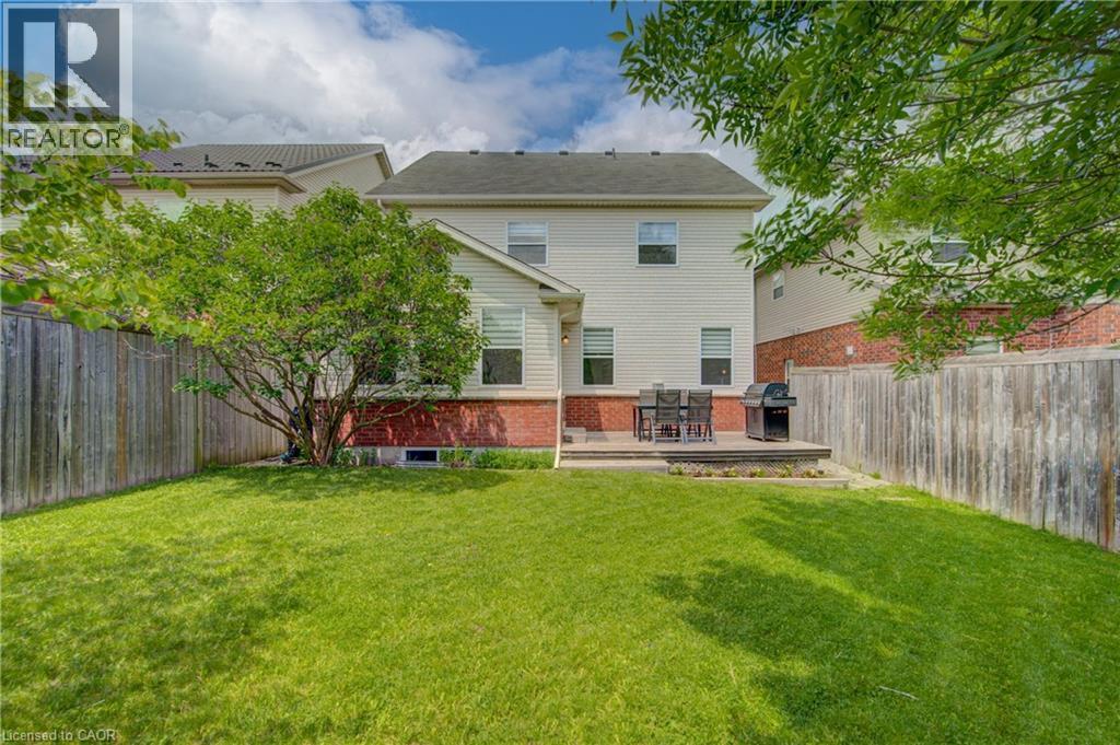 Expansive lawn area with a raised outdoor patio - 729 Keats Way, Waterloo, ON - Outdoor