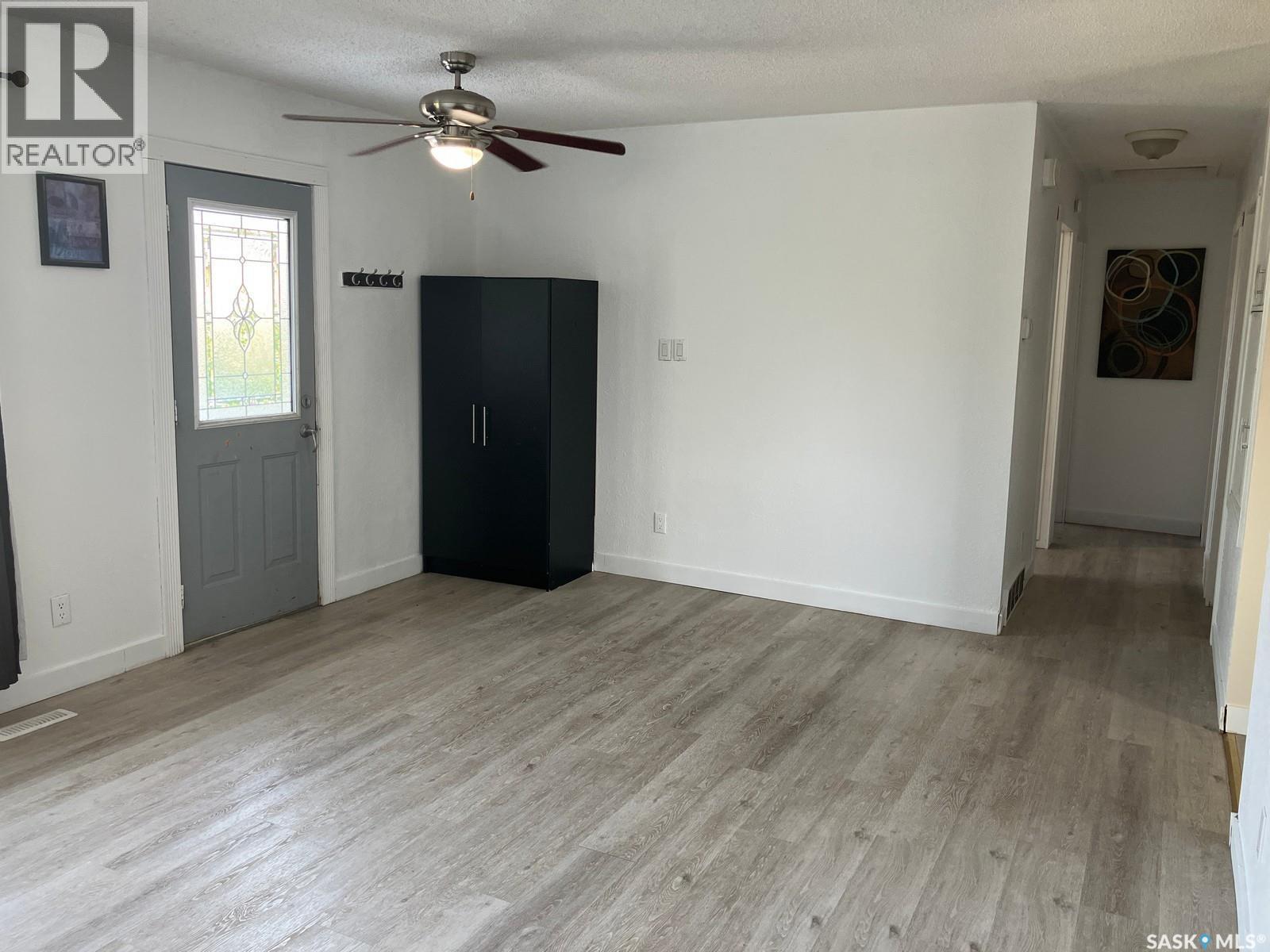 110 4Th Street N, Nipawin, SK - Indoor Photo Showing Other Room With Fireplace