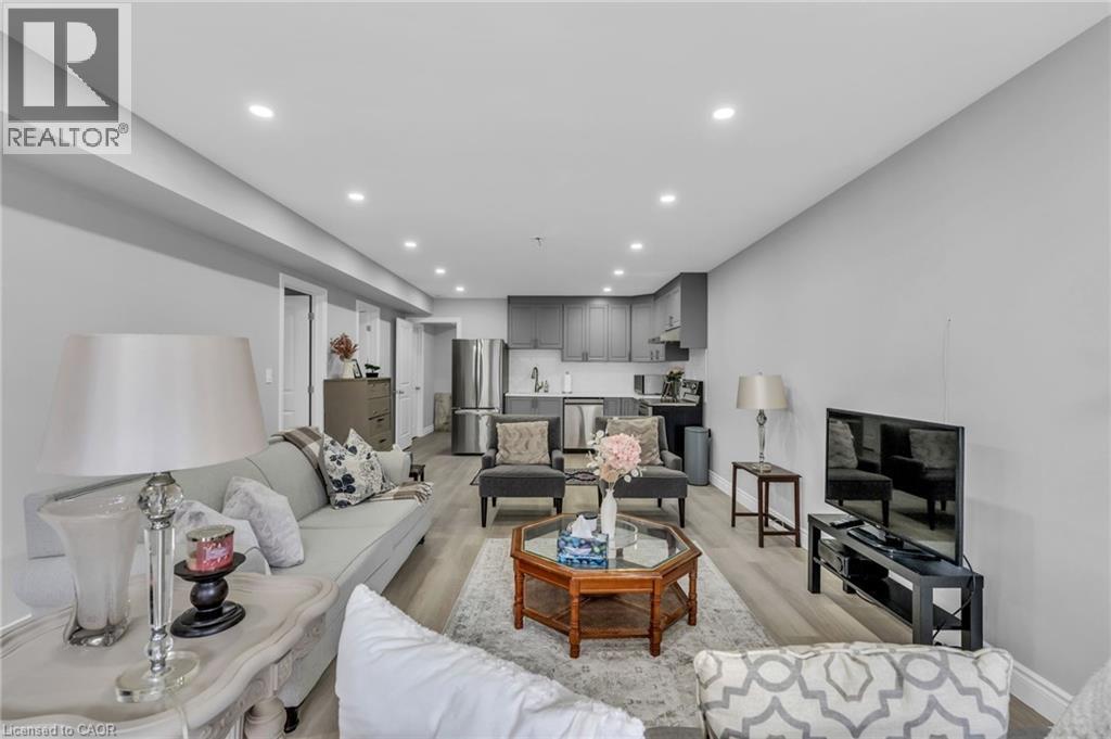 Open-concept living area featuring recessed lighting and light wood-finish flooring - 2195 Ironwood Road, London, ON - Indoor Photo Showing Living Room