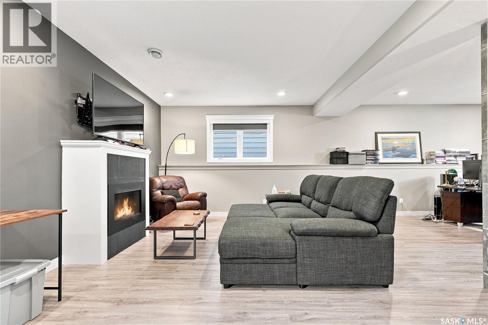 635 Redwood Crescent, Warman, SK - Indoor Photo Showing Living Room With Fireplace