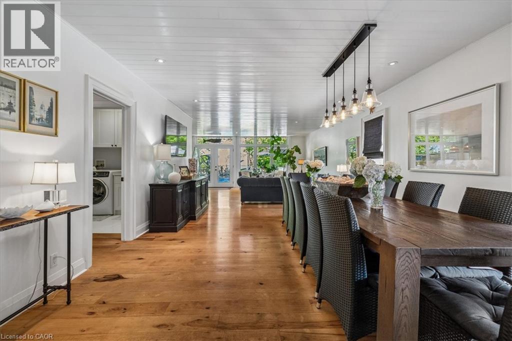 Expansive interior featuring wood-finish flooring, white shiplap ceiling, and recessed lighting - 573 Beach Boulevard, Hamilton, ON - Indoor Photo Showing Dining Room