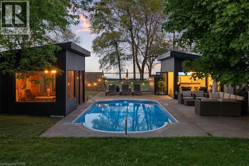 Backyard oasis featuring an in-ground swimming pool with concrete surround - 573 Beach Boulevard, Hamilton, ON - Outdoor With In Ground Pool With Deck Patio Veranda With Backyard