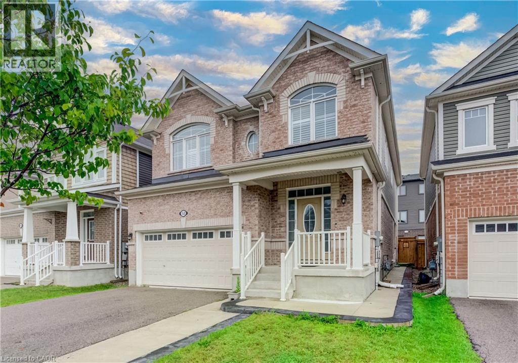 Brick and siding exterior featuring a covered porch with white railings - 52 Pointer Street, Cambridge, ON - Outdoor With Facade