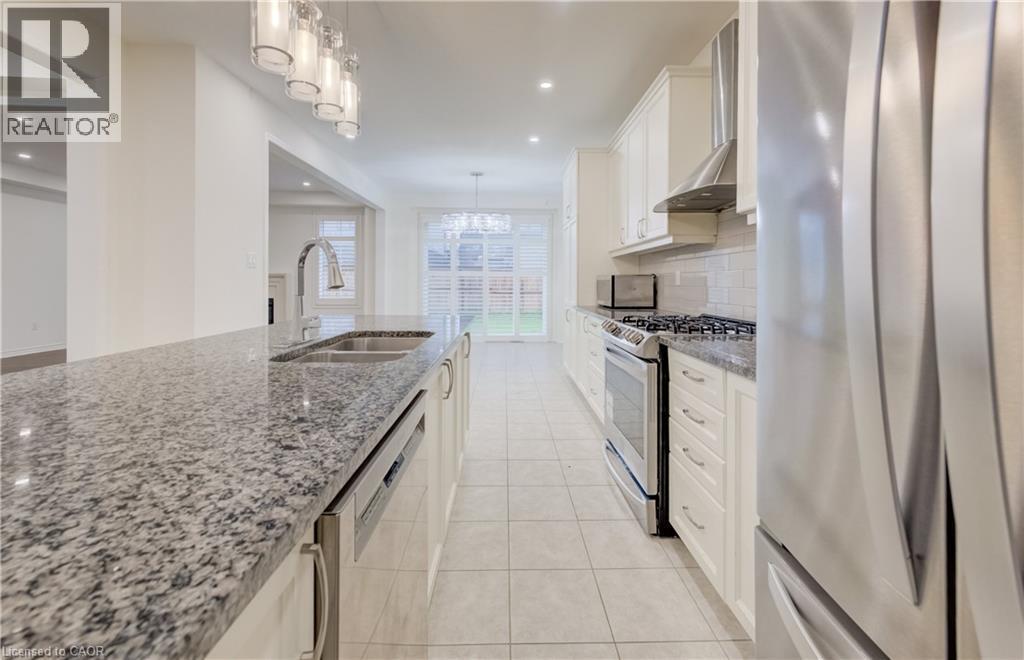 Kitchen featuring granite countertops, stainless steel appliances, white cabinetry, and recessed lighting - 52 Pointer Street, Cambridge, ON - Indoor Photo Showing Kitchen With Double Sink With Upgraded Kitchen