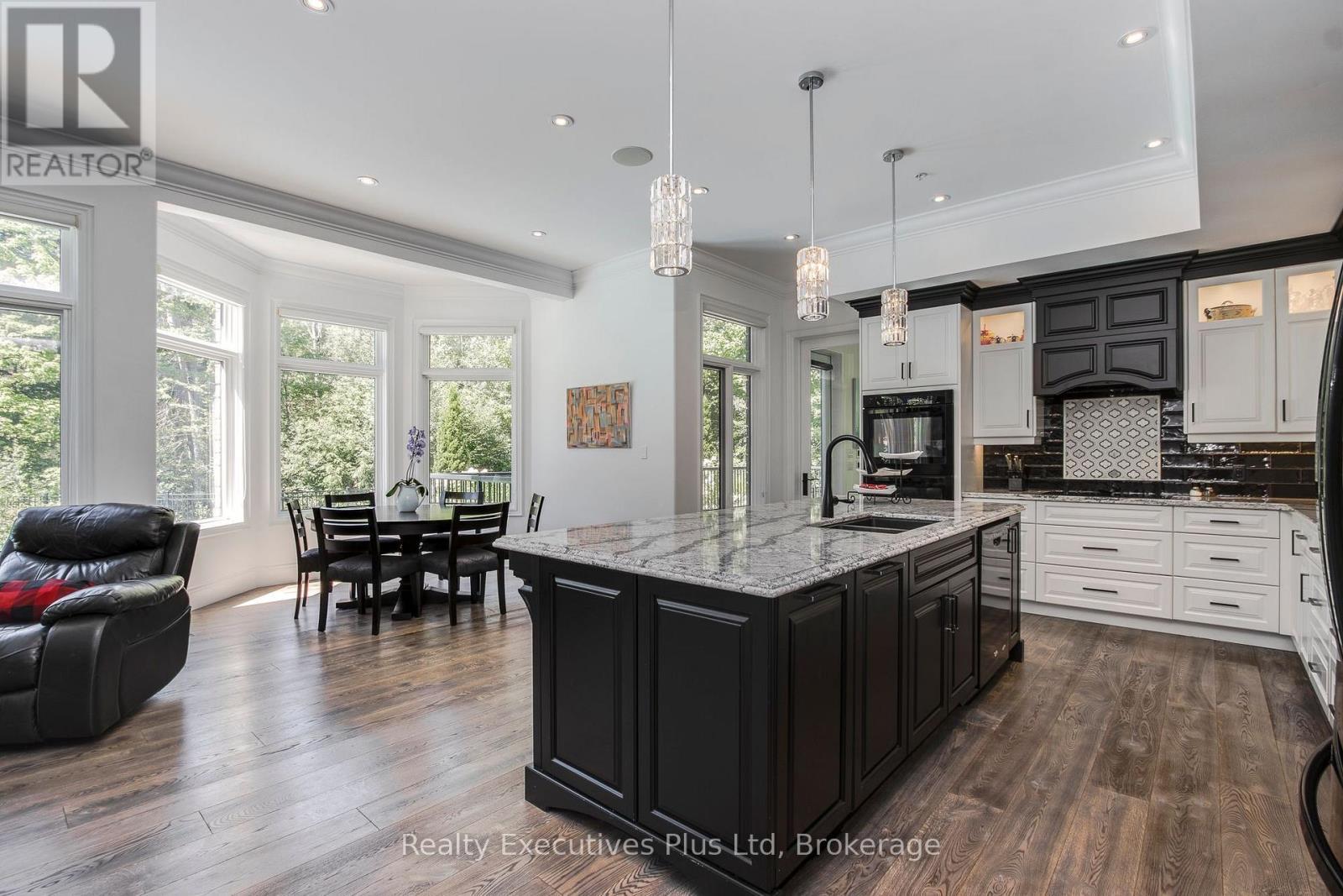 Kitchen Island & Breakfast Nook - 27 Kingfisher Crescent, Tiny, ON - Indoor Photo Showing Kitchen With Double Sink With Upgraded Kitchen