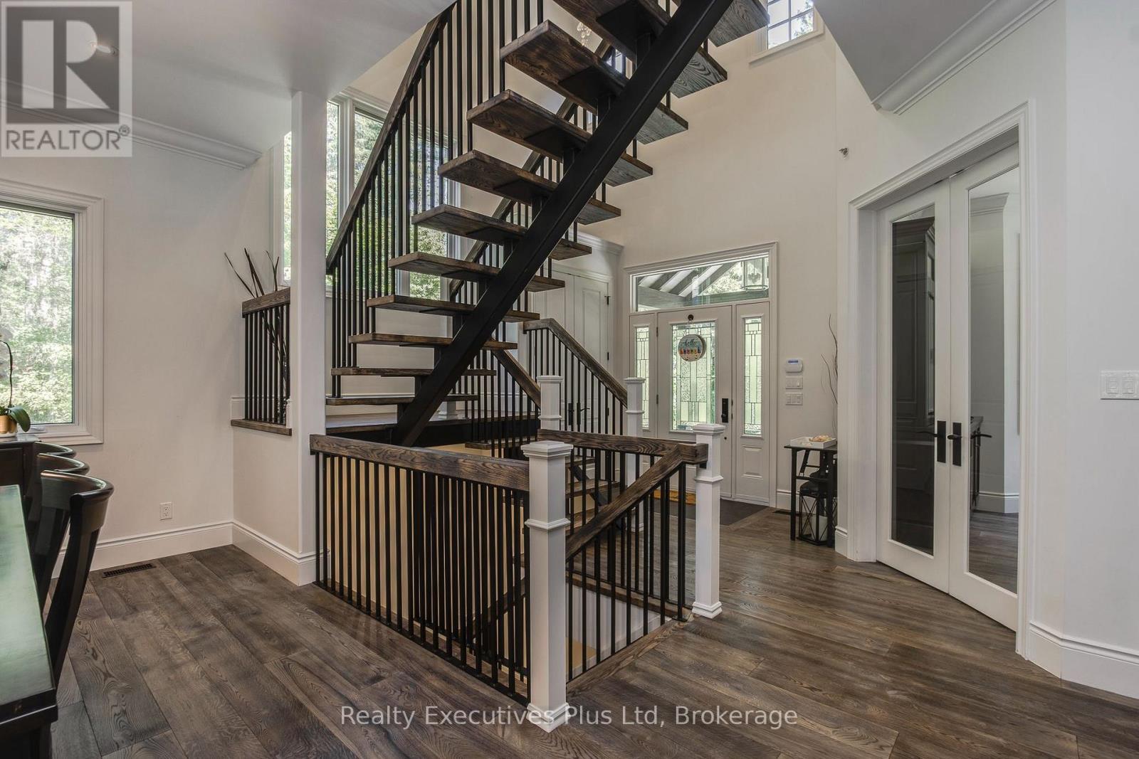 Foyer with Staircase - 27 Kingfisher Crescent, Tiny, ON - Indoor Photo Showing Other Room