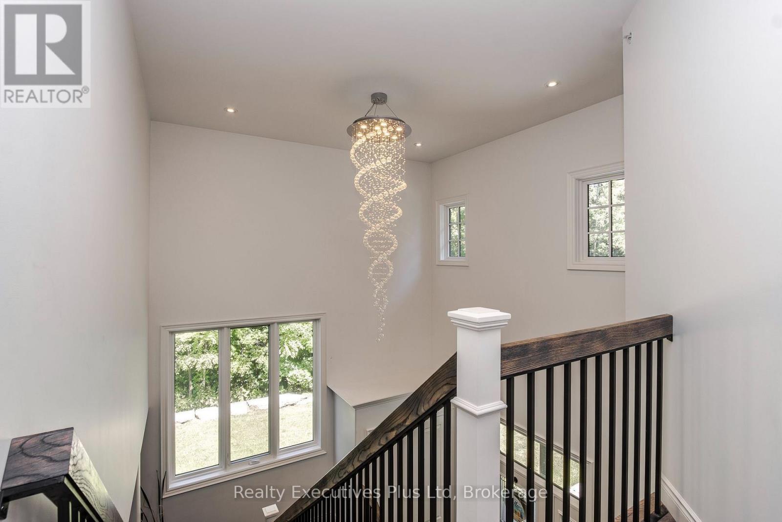 Upper Foyer Chandalier - 27 Kingfisher Crescent, Tiny, ON - Indoor Photo Showing Other Room
