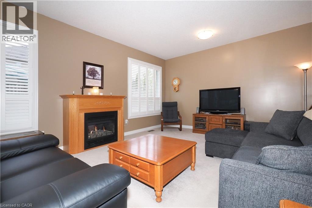 565 Springwater Drive, Waterloo, ON - Indoor Photo Showing Living Room With Fireplace