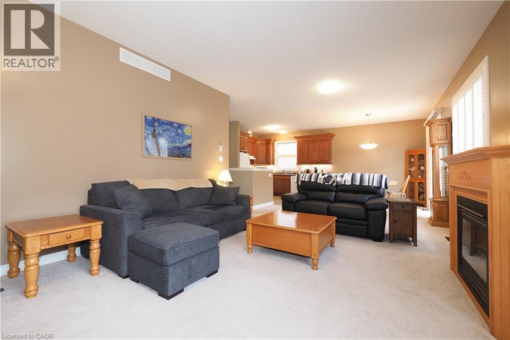 565 Springwater Drive, Waterloo, ON - Indoor Photo Showing Living Room With Fireplace