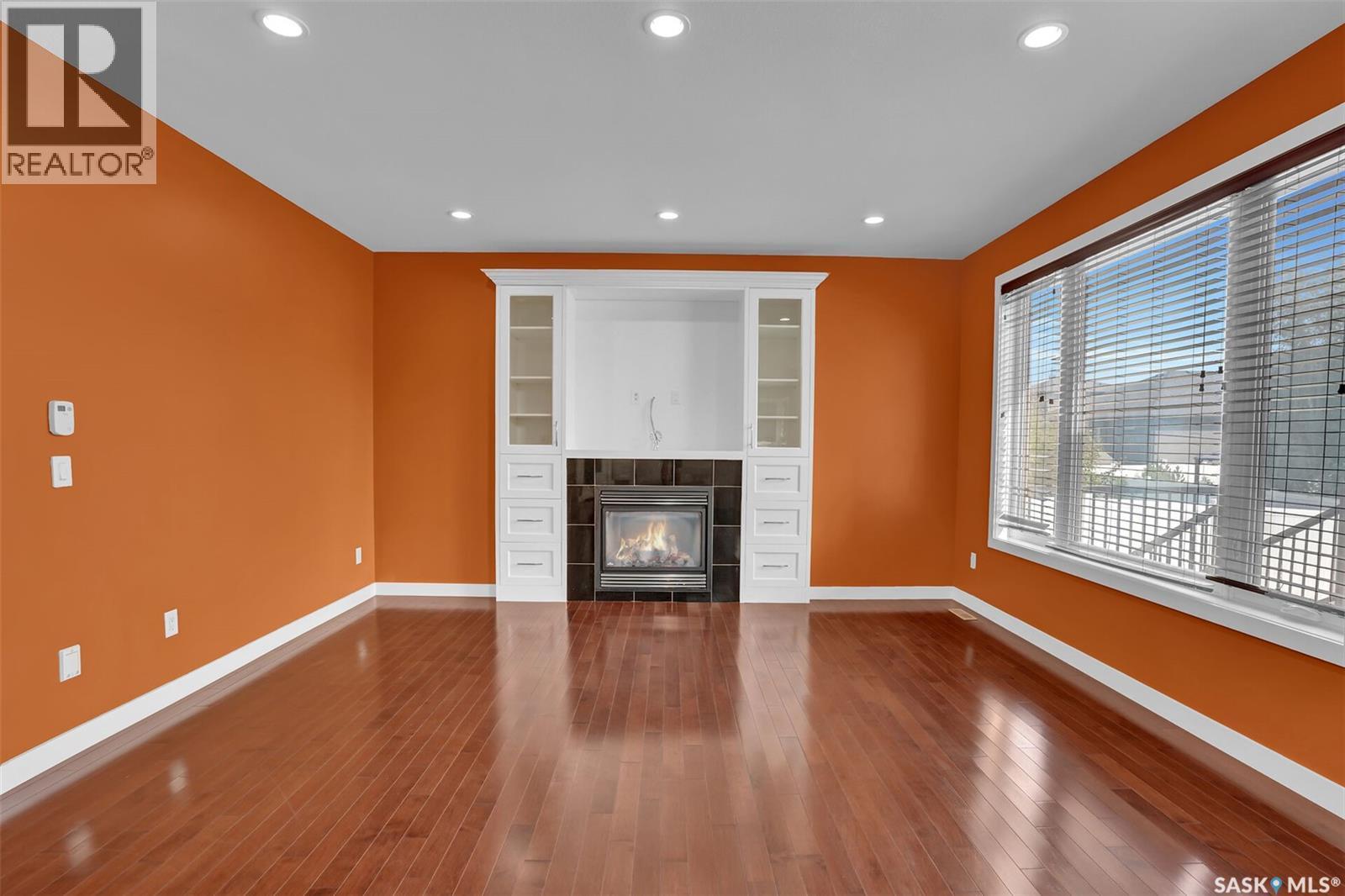 6033 Little Pine Loop, Regina, SK - Indoor Photo Showing Other Room With Fireplace