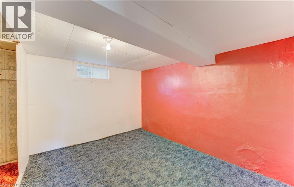 Carpeted room featuring a white wall with a horizontal window - 224 Weber Street E, Kitchener, ON - Indoor